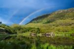 Rainbow Over Mountain Stock Photo