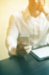 Man With Smartphone In Office Stock Photo