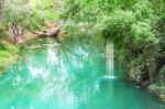 Canal In Tropical Forest And Small Waterfall Stock Photo