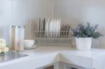 Row Of Plate On Counter In Kitchen Room Stock Photo