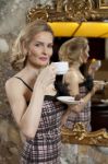 Cute Young Lady With A Cup Of Coffee And Chocolate Stock Photo