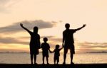 Silhouette Family At Beach Stock Photo