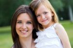 Mother And Daughter Having Fun Outdoors Stock Photo