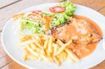 Grilled Chicken Steak With French Fries And Vegetables Stock Photo