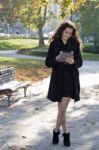 Young Woman In The Park With Tablet Pc Stock Photo