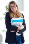 Beautiful Young Business Woman Looking At Camera Stock Photo