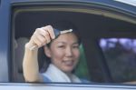 Woman With Car Key Stock Photo