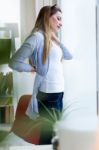 Beautiful Young Businesswoman Taking A Break In The Office Stock Photo