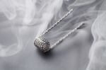 Ribbon Twist Coil For Vaping On A Black Background Smoke Stock Photo