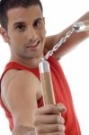 Smiling Male Showing Nunchaku Stock Photo