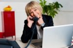 Happy Woman Enjoying Her Conversation Stock Photo