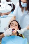 Cute Young Woman At The Dentist. Mouth Checkup Stock Photo