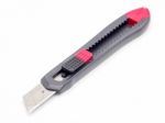 Black And Red Plastic Cutter Knife Isolated Stock Photo