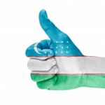 Flag Of Uzbekistan On Thumb Up Hand Stock Photo