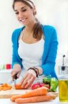 Pretty Young Woman Cooking At Home Stock Photo