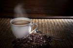 Hot Coffee And Roast Bean On Wood Stock Photo