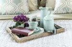 Decorative Tray With Book,tea Set And Flower On The Bed Stock Photo