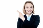 Young Business Girl Pointing Away Stock Photo