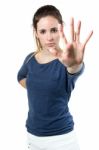 Young Woman Making Stop Sign In Front Of The Camera Stock Photo