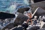 Man Fishing In San Juan Tenerife Stock Photo