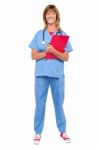 Smiling Confident Doctor Holding Clipboard Stock Photo