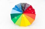 Colorful Umbrella In The Fresh Snow Stock Photo