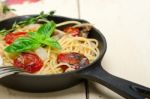 Spaghetti Pasta With Baked Cherry Tomatoes And Basil Stock Photo