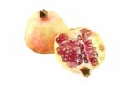 Pomegranate And One Half On White Background Stock Photo