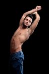 Muscular Young Man With On A Black Background Stock Photo