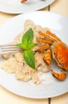 Italian Gnocchi With Seafood Sauce With Crab And Basil Stock Photo