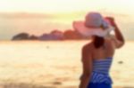 Blurred Image Tourist Woman On The Beach Stock Photo