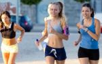 Group Of Women Running In The Park Stock Photo