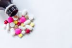 Top View Of The Pills On The White Background, The Drug And Capsule Pills On The Floor Stock Photo