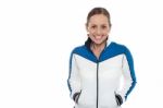 Woman In Sporty Jacket Smiling Warmly Stock Photo