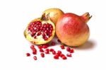 Whole And Halved Pomegranate Stock Photo