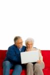 Elderly Couple With Laptop Stock Photo