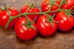 Fresh Cherry Tomatoes On A Cluster Stock Photo