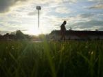 Silhouette  Running On Road At Sunrise Stock Photo