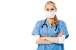 Young Female Surgeon Wearing Face Mask Stock Photo