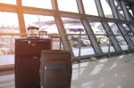 Black Luggage In The Airport Terminal Stock Photo