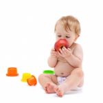 Cute Infant Boy With Apple Stock Photo