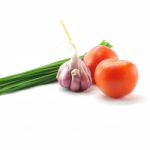 Mediterranean Food Ingredients: Spring Onions, Garlic And Tomato Stock Photo