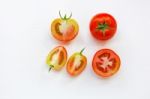 Fresh Tomatoes On White Wooden Background Stock Photo