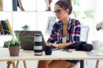 Young Businesswoman Working In Her Office With Laptop Stock Photo