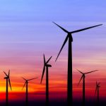 Wind Turbine Silhouette On Colorful Sunset Stock Photo