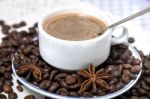 Coffee Cup With Spreaded Beans Stock Photo