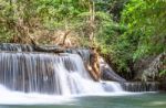 The Water Flowing Over Rocks And Trees Down A Waterfall At Huay Mae Khamin Waterfall National Park ,kanchana Buri In Thailand Stock Photo