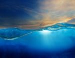 Under Clear Water With Beautiful Dramatic Sky Above Stock Photo