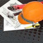 Orange Hard Hat On Blueprint Stock Photo