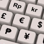 Currency Symbols On Computer Keys Stock Photo